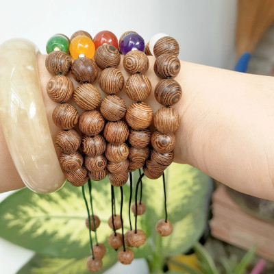 Vòng tay phong thủy hạt gỗ tròn mix 1 hạt đá thiên nhiên và bi bạc kết dây thủ công