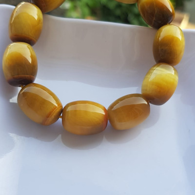 Vòng Tay Phong Thủy Nam Mệnh Thổ Kim Thủy Mới Đẹp Hạt Lu Thống Mới Vàng Nâu bóng đẹp Chất liệu đá mắt hổ tự nhiên vàng nâu bóng đẹp ạ Size hạt 14mm x dài 19mm ạ