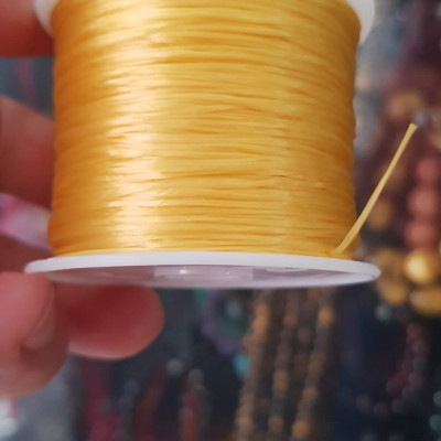Cuộn Dây Thun CO GIÃN màu Vàng xỏ vòng hạt chuỗi Dây này là dây thun chuyên xỏ vòng chuỗi màu Vàng, có đủ màu .. Anh Chị đang đeo chuỗi muốn thay dây khác cho vòng thì đặt cuộn Thun chỉ này nhé