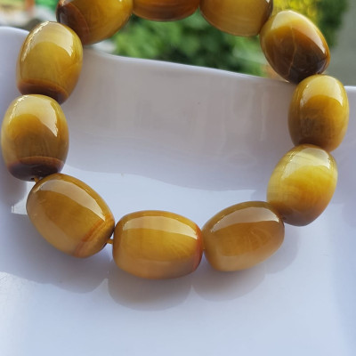 Vòng Tay Phong Thủy Nam Mệnh Thổ Kim Thủy Mới Đẹp Hạt Lu Thống Mới Vàng Nâu bóng đẹp Chất liệu đá mắt hổ tự nhiên vàng nâu bóng đẹp ạ Size hạt 14mm x dài 19mm ạ