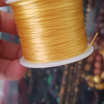 Cuộn Dây Thun CO GIÃN màu Vàng xỏ vòng hạt chuỗi Dây này là dây thun chuyên xỏ vòng chuỗi màu Vàng, có đủ màu .. Anh Chị đang đeo chuỗi muốn thay dây khác cho vòng thì đặt cuộn Thun chỉ này nhé