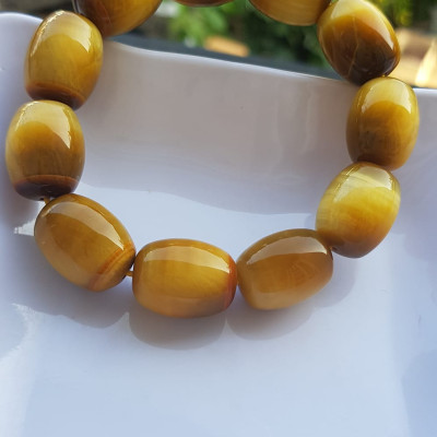 Vòng Tay Phong Thủy Nam Mệnh Thổ Kim Thủy Mới Đẹp Hạt Lu Thống Mới Vàng Nâu bóng đẹp Chất liệu đá mắt hổ tự nhiên vàng nâu bóng đẹp ạ Size hạt 14mm x dài 19mm ạ