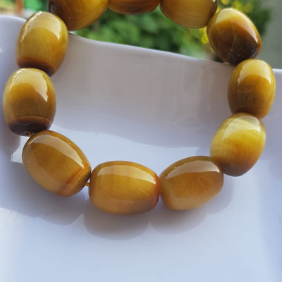 Vòng Tay Phong Thủy Nam Mệnh Thổ Kim Thủy Mới Đẹp Hạt Lu Thống Mới Vàng Nâu bóng đẹp Chất liệu đá mắt hổ tự nhiên vàng nâu bóng đẹp ạ Size hạt 14mm x dài 19mm ạ