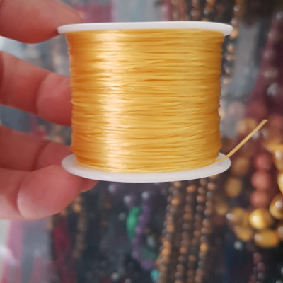 Cuộn Dây Thun CO GIÃN màu Vàng xỏ vòng hạt chuỗi Dây này là dây thun chuyên xỏ vòng chuỗi màu Vàng, có đủ màu .. Anh Chị đang đeo chuỗi muốn thay dây khác cho vòng thì đặt cuộn Thun chỉ này nhé