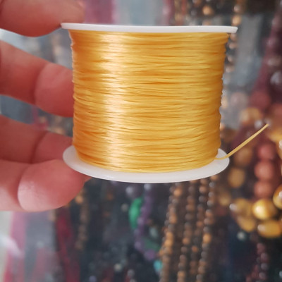 Cuộn Dây Thun CO GIÃN màu Vàng xỏ vòng hạt chuỗi Dây này là dây thun chuyên xỏ vòng chuỗi màu Vàng, có đủ màu .. Anh Chị đang đeo chuỗi muốn thay dây khác cho vòng thì đặt cuộn Thun chỉ này nhé