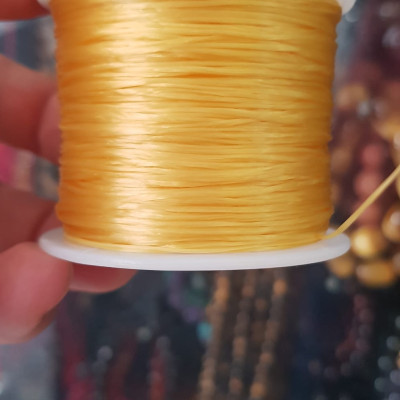 Cuộn Dây Thun CO GIÃN màu Vàng xỏ vòng hạt chuỗi Dây này là dây thun chuyên xỏ vòng chuỗi màu Vàng, có đủ màu .. Anh Chị đang đeo chuỗi muốn thay dây khác cho vòng thì đặt cuộn Thun chỉ này nhé