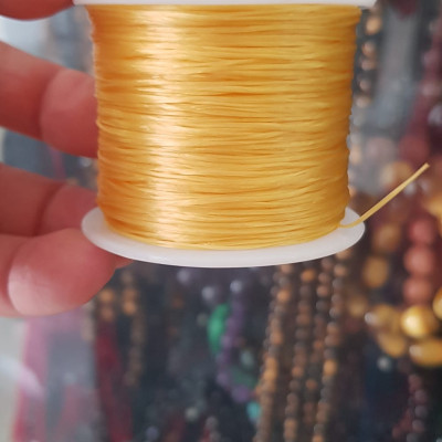 Cuộn Dây Thun CO GIÃN màu Vàng xỏ vòng hạt chuỗi Dây này là dây thun chuyên xỏ vòng chuỗi màu Vàng, có đủ màu .. Anh Chị đang đeo chuỗi muốn thay dây khác cho vòng thì đặt cuộn Thun chỉ này nhé