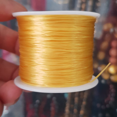 Cuộn Dây Thun CO GIÃN màu Vàng xỏ vòng hạt chuỗi Dây này là dây thun chuyên xỏ vòng chuỗi màu Vàng, có đủ màu .. Anh Chị đang đeo chuỗi muốn thay dây khác cho vòng thì đặt cuộn Thun chỉ này nhé
