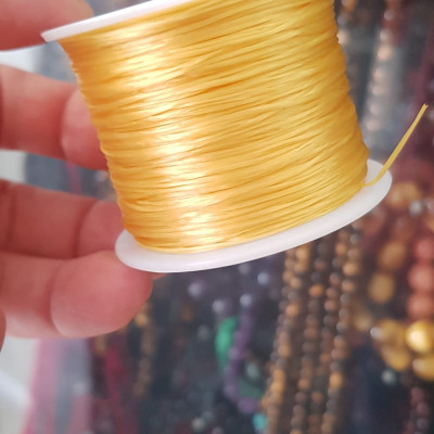 Cuộn Dây Thun CO GIÃN màu Vàng xỏ vòng hạt chuỗi Dây này là dây thun chuyên xỏ vòng chuỗi màu Vàng, có đủ màu .. Anh Chị đang đeo chuỗi muốn thay dây khác cho vòng thì đặt cuộn Thun chỉ này nhé