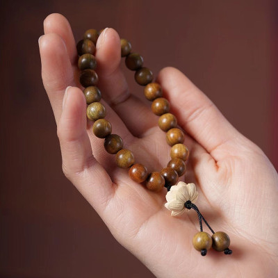 VÒNG TAY GỖ ĐÀN HƯƠNG XANH ĐỔI MÀU VÀ HOA SEN GỖ HOÀNG DƯƠNG CÓ TUA RUA