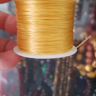 Cuộn Dây Thun CO GIÃN màu Vàng xỏ vòng hạt chuỗi Dây này là dây thun chuyên xỏ vòng chuỗi màu Vàng, có đủ màu .. Anh Chị đang đeo chuỗi muốn thay dây khác cho vòng thì đặt cuộn Thun chỉ này nhé