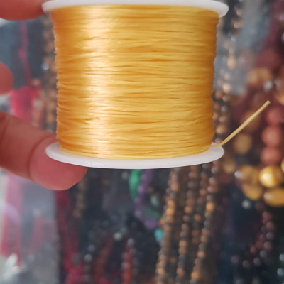 Cuộn Dây Thun CO GIÃN màu Vàng xỏ vòng hạt chuỗi Dây này là dây thun chuyên xỏ vòng chuỗi màu Vàng, có đủ màu .. Anh Chị đang đeo chuỗi muốn thay dây khác cho vòng thì đặt cuộn Thun chỉ này nhé