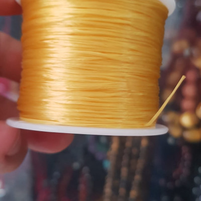 Cuộn Dây Thun CO GIÃN màu Vàng xỏ vòng hạt chuỗi Dây này là dây thun chuyên xỏ vòng chuỗi màu Vàng, có đủ màu .. Anh Chị đang đeo chuỗi muốn thay dây khác cho vòng thì đặt cuộn Thun chỉ này nhé