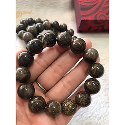 Vòng Gỗ Hóa Thạch Nam Đeo Tay Rất Đẹp Hiếm có hàng size 14mm  Vòng size 14ly gồm 14 hạt vào cung nam đeo được hết ạ Màu Nâu Đậm Vân Gỗ Tự Nhiên Nam đeo Đẹp Sang Tay tốt rẻ ạ
