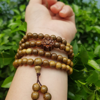 Vòng đeo tay nữ gỗ trầm mix bông hoa sen kiểu quấn tay 4 vòng may mắn tài lộc  Size hạt 6mm  Màu vàng nâu vân sáng nhẹ đeo tay rất đẹp xinh mùi thơm nhẹ nhẹ ạ