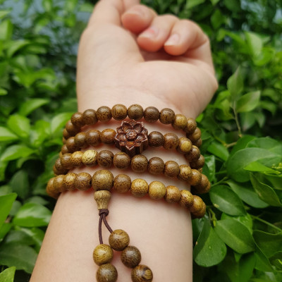 Vòng đeo tay nữ gỗ trầm mix bông hoa sen kiểu quấn tay 4 vòng may mắn tài lộc  Size hạt 6mm  Màu vàng nâu vân sáng nhẹ đeo tay rất đẹp xinh mùi thơm nhẹ nhẹ ạ